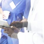 Group of doctors on a digital tablet