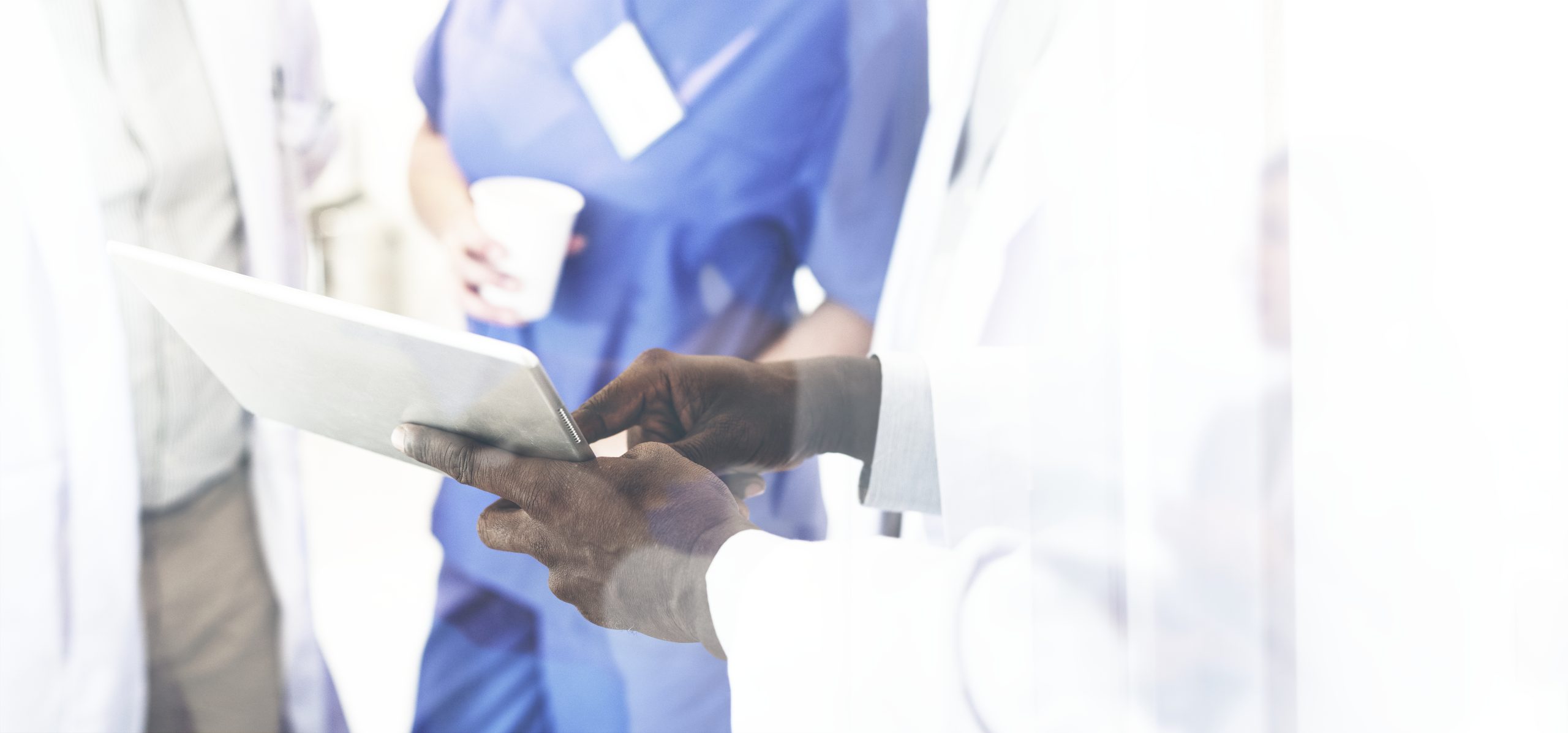 Group of doctors on a digital tablet