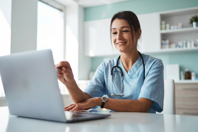 Doctor reading 30 Best Digital Health Platforms for Clinics & Hospitals